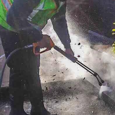 Hot water pressure washing gum removal in Scottsdale, AZ.